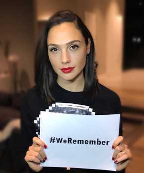Actress with #weremember sign