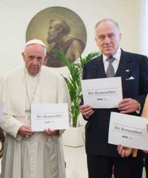 The Pope holding #weremember sign